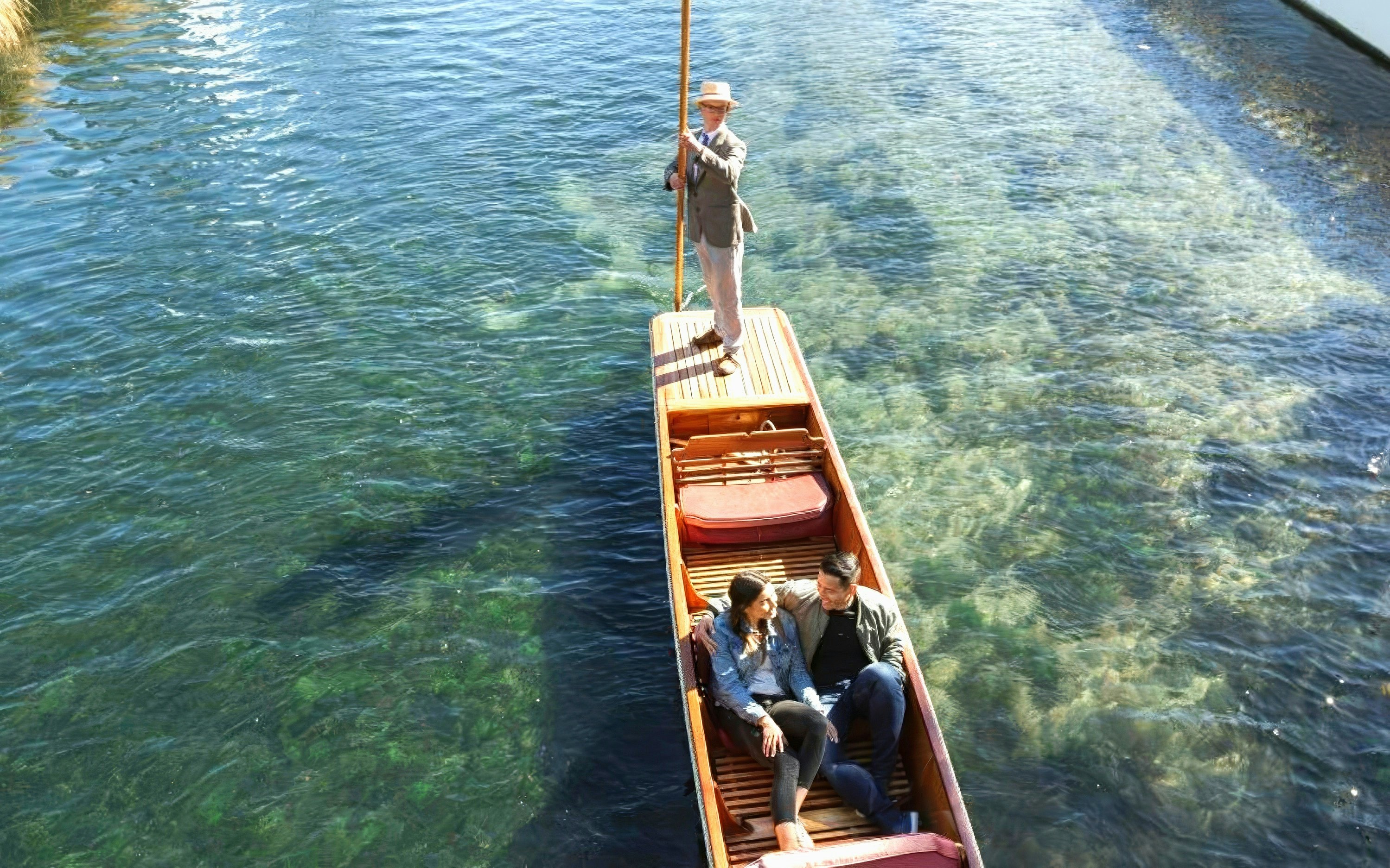 Couple enjoying a punting ride on the Avon River, Christchurch.