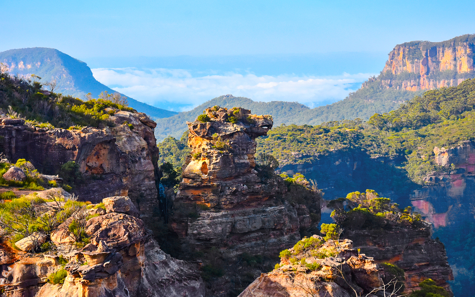 Boars Head rock formation in Blue Mountains, Australia, surrounded by lush greenery and cliffs.