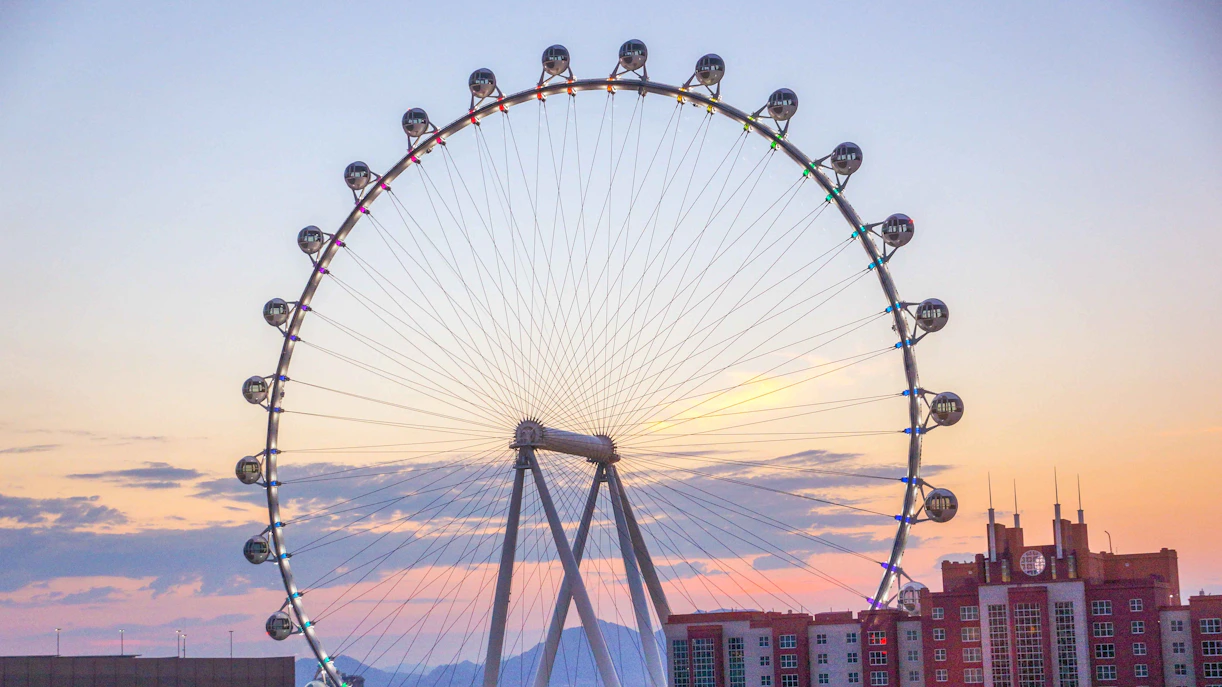 High Roller Observation Wheel at sunset in Las Vegas with cityscape.