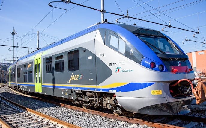 Train on tracks for Cinque Terre skip-the-line pass, Italy.