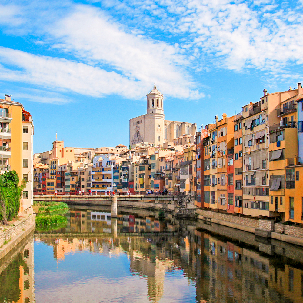 Colorful houses reflected in the river in Girona, Catalonia, Spain.