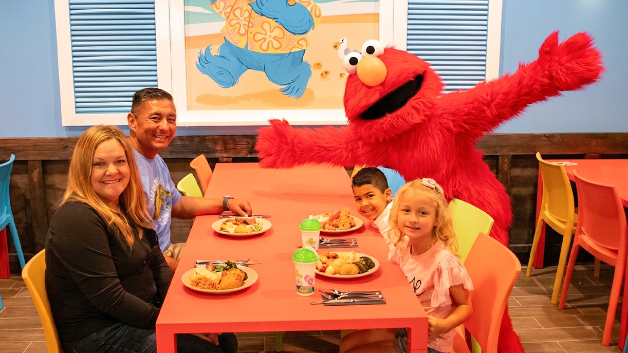 Family dining with Elmo at Sesame Place San Diego.