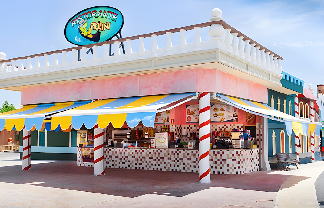 Ristorante Piolini at Parque Warner Madrid with colorful awnings and outdoor seating.