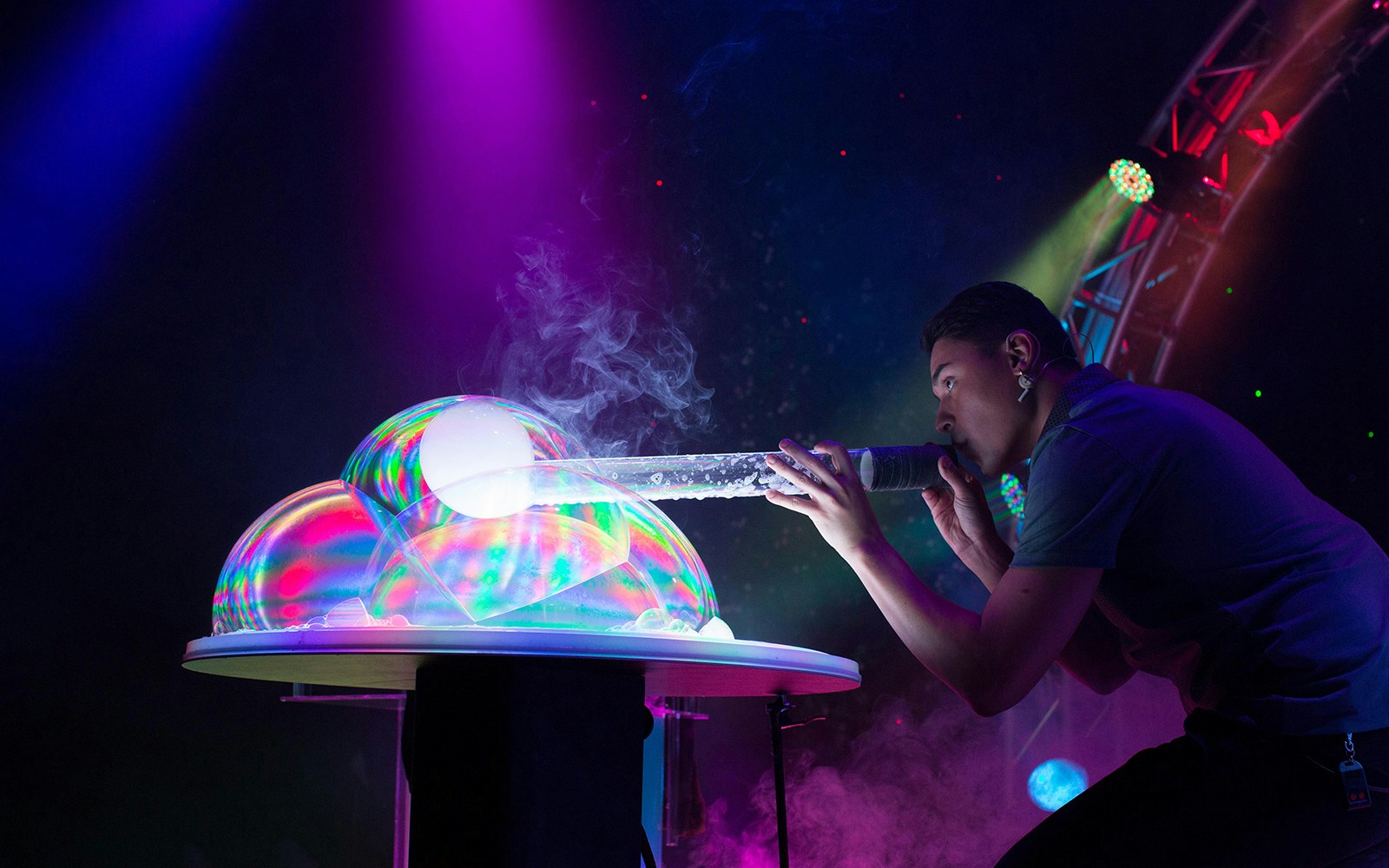 Performer creating bubbles on stage at The Gazillion Bubble Show.