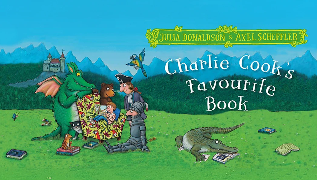 Characters gathered around a book in a grassy field with a castle in the background.