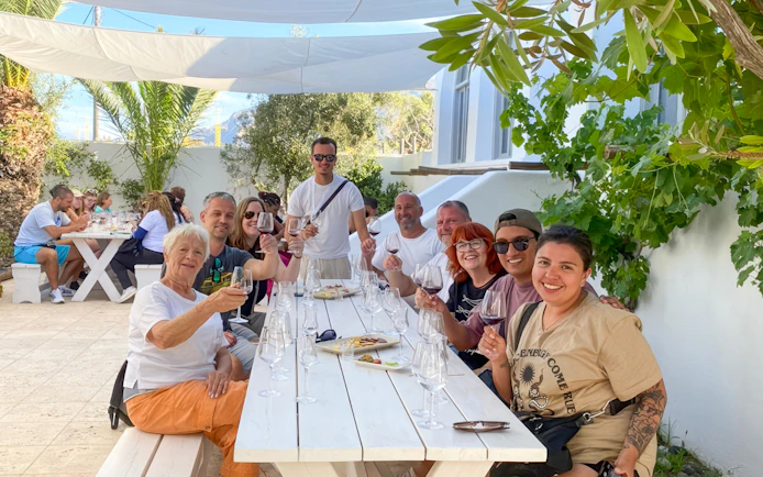 Group enjoying wine tasting on a Santorini Sunset Wine Tour.