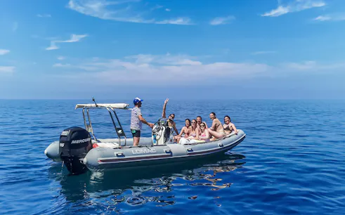 Tourists enjoying a boat cruise in Cinque Terre, Italy.
