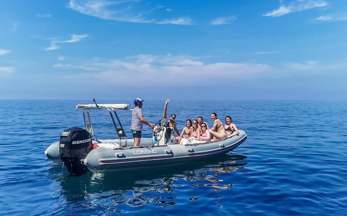 Tourists enjoying a boat cruise in Cinque Terre, Italy.