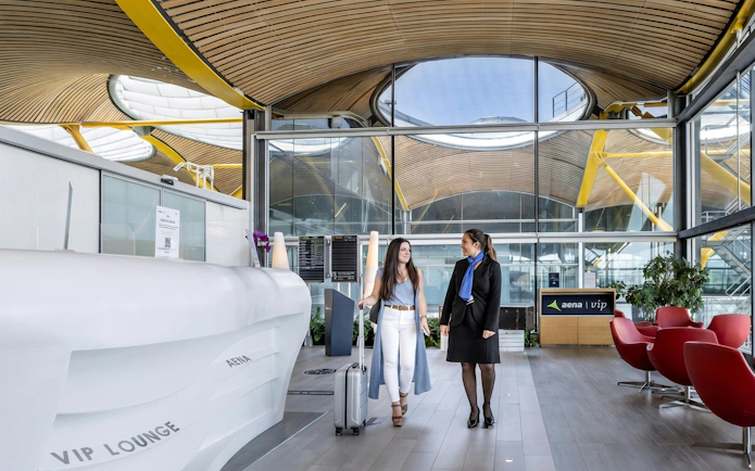Sala VIP Neptuno lounge at Adolfo Suarez-Barajas Airport, Madrid, with modern seating and travelers.