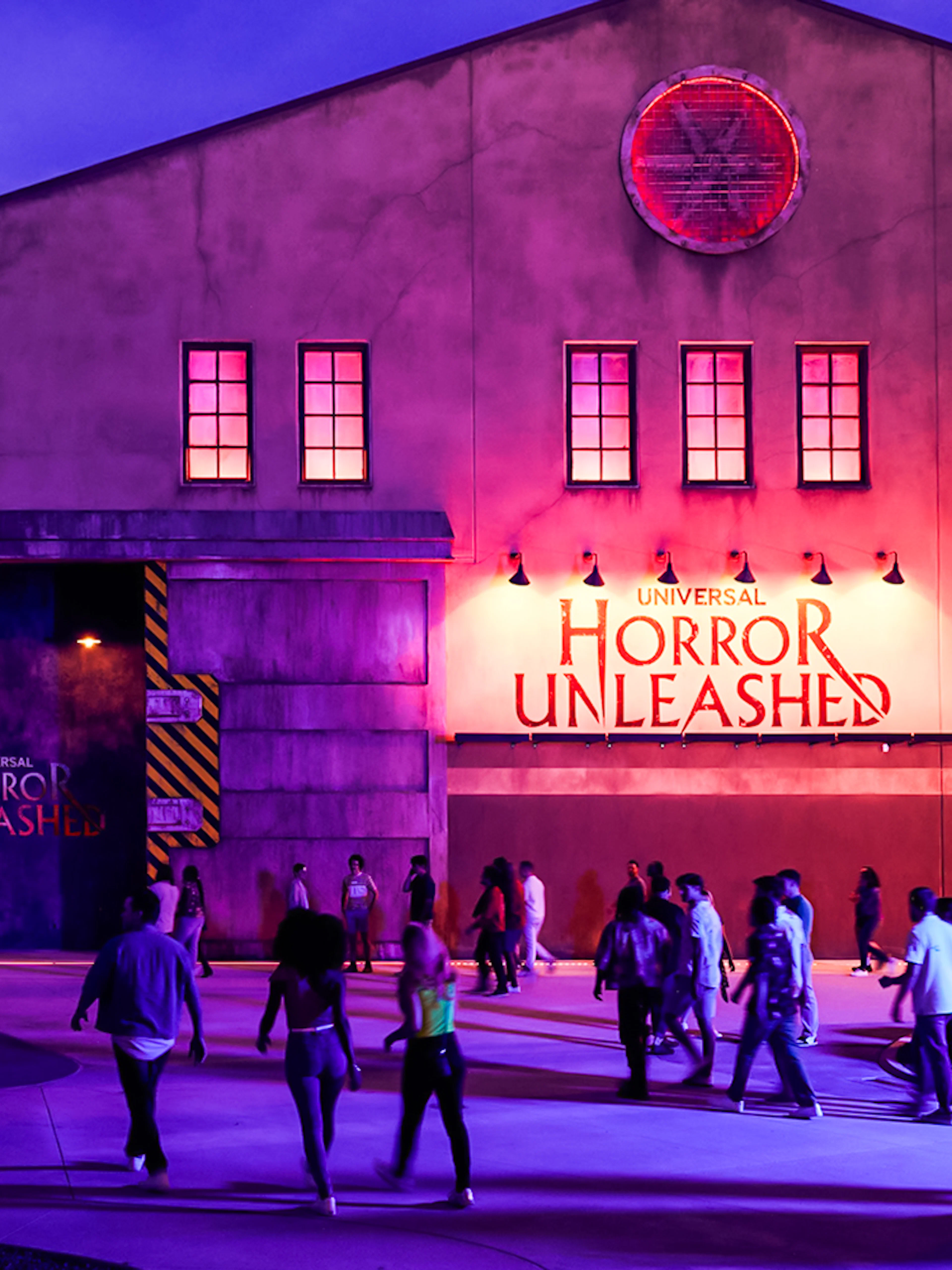 Entrance to Universal Horror Unleashed in Las Vegas with visitors walking.
