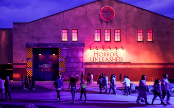 Entrance to Universal Horror Unleashed in Las Vegas with visitors walking.