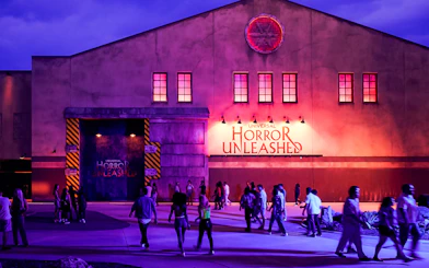 Entrance to Universal Horror Unleashed in Las Vegas with visitors walking.