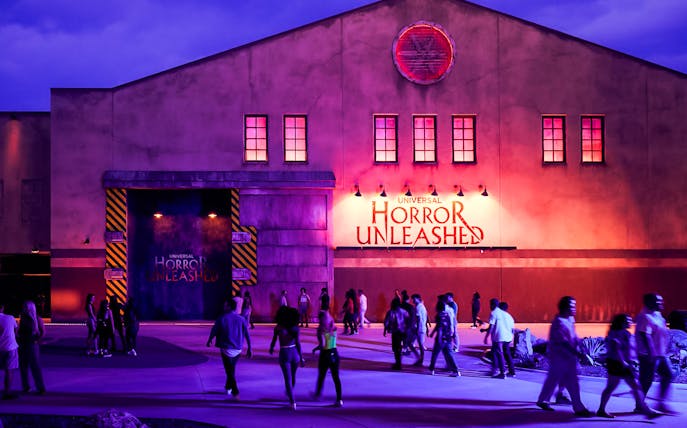 Entrance to Universal Horror Unleashed in Las Vegas with visitors walking.