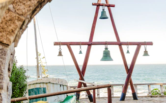 Bells overlooking the ocean at Isla Negra, part of the Santiago day tour.