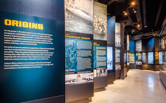 Exhibit panels detailing Navy SEAL history at The National Navy SEAL Museum, San Diego.
