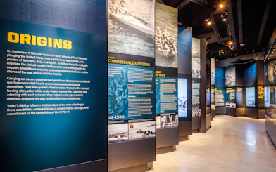 Exhibit panels detailing Navy SEAL history at The National Navy SEAL Museum, San Diego.