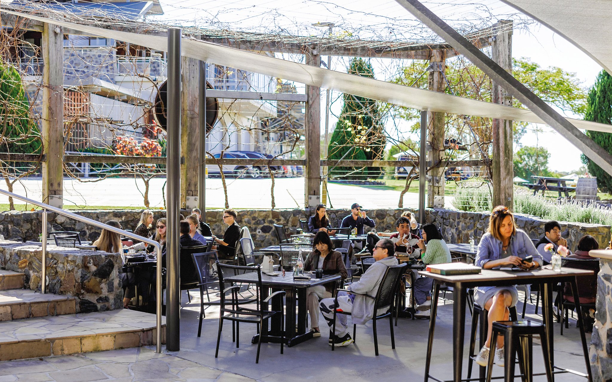 Visitors dining outdoors at Sirromet Winery, Gold Coast.