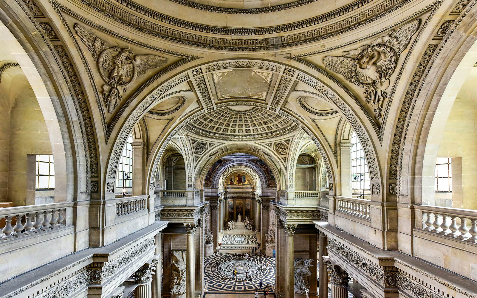 Pantheon main hall in Paris with grand columns and intricate ceiling design.