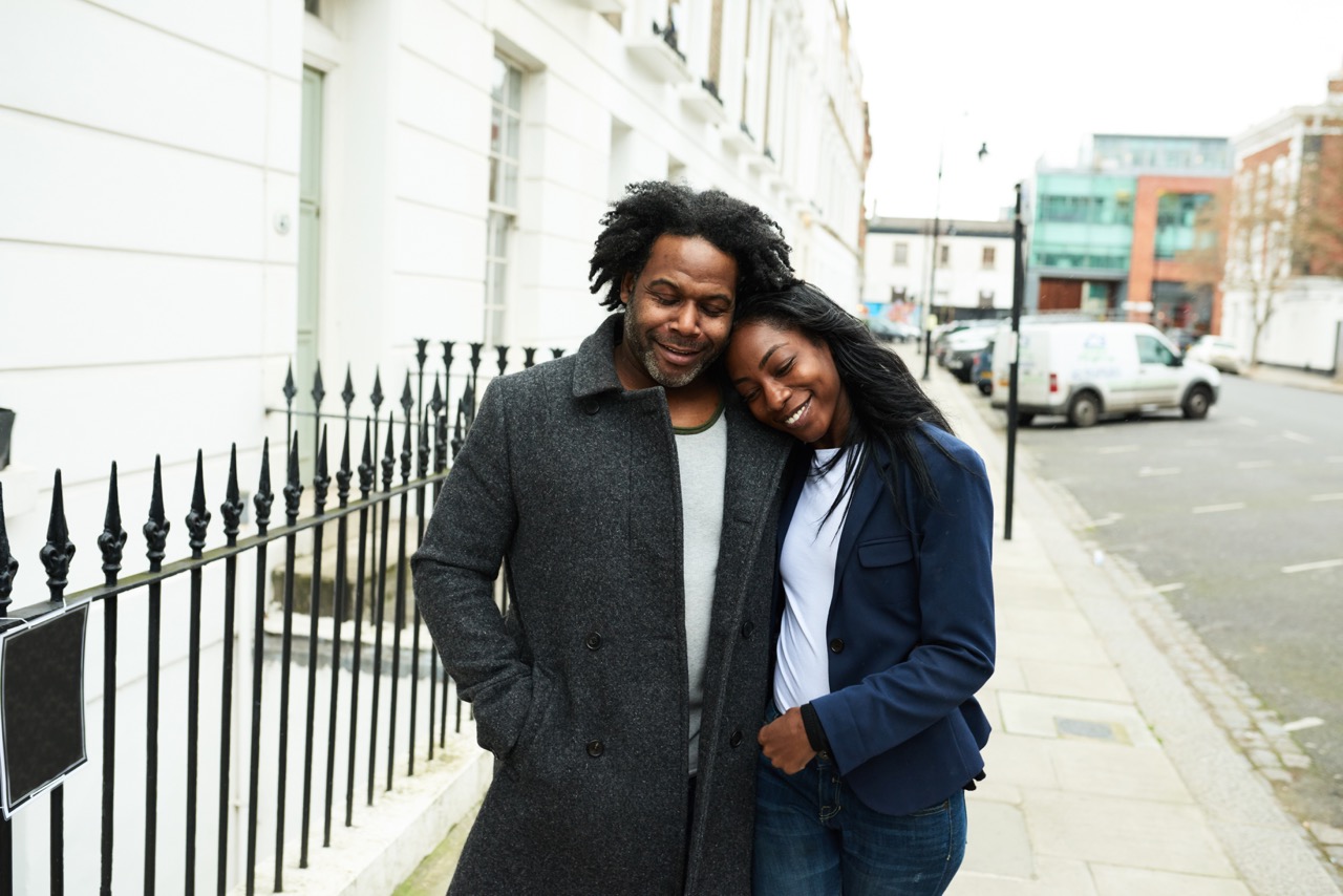 Couple enjoying a romantic walk on a London street during Valentine's Day tour.
