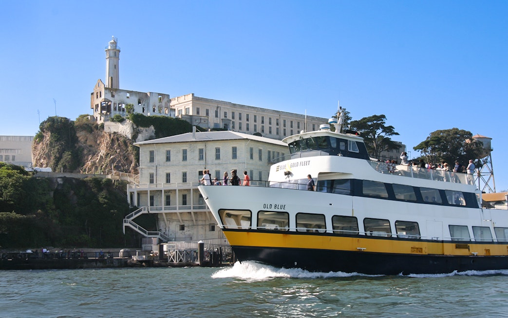 Ferry passing by Alcatraz Island in San Francisco, California.