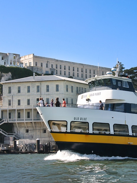 Ferry passing by Alcatraz Island in San Francisco, California.