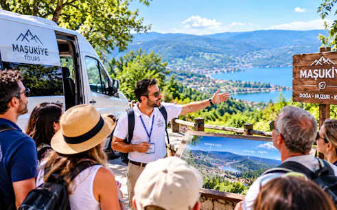 Tour guide explaining Sapanca Lake view on Istanbul day trip.