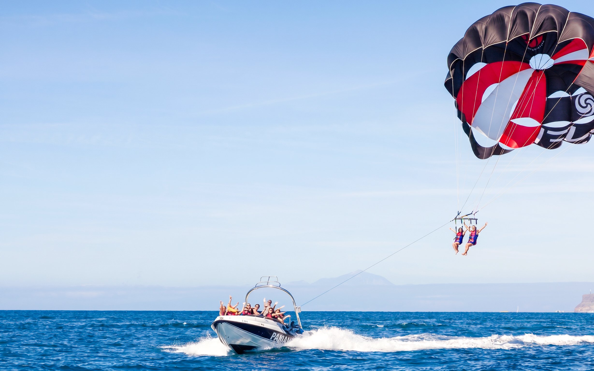 Parasailing adventure off the east coast of Mauritius with a speedboat.