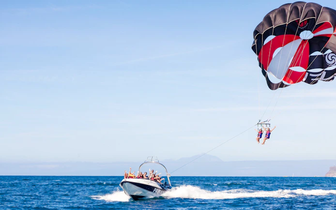 Parasailing adventure off the east coast of Mauritius with a speedboat.