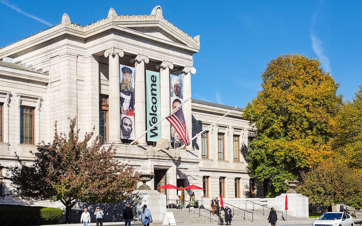Museum of Fine Arts Boston entrance with banners and visitors.