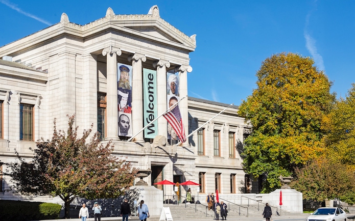 Museum of Fine Arts Boston exterior with banners and visitors.