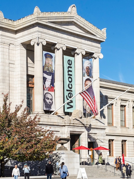 Museum of Fine Arts Boston exterior with banners and visitors.