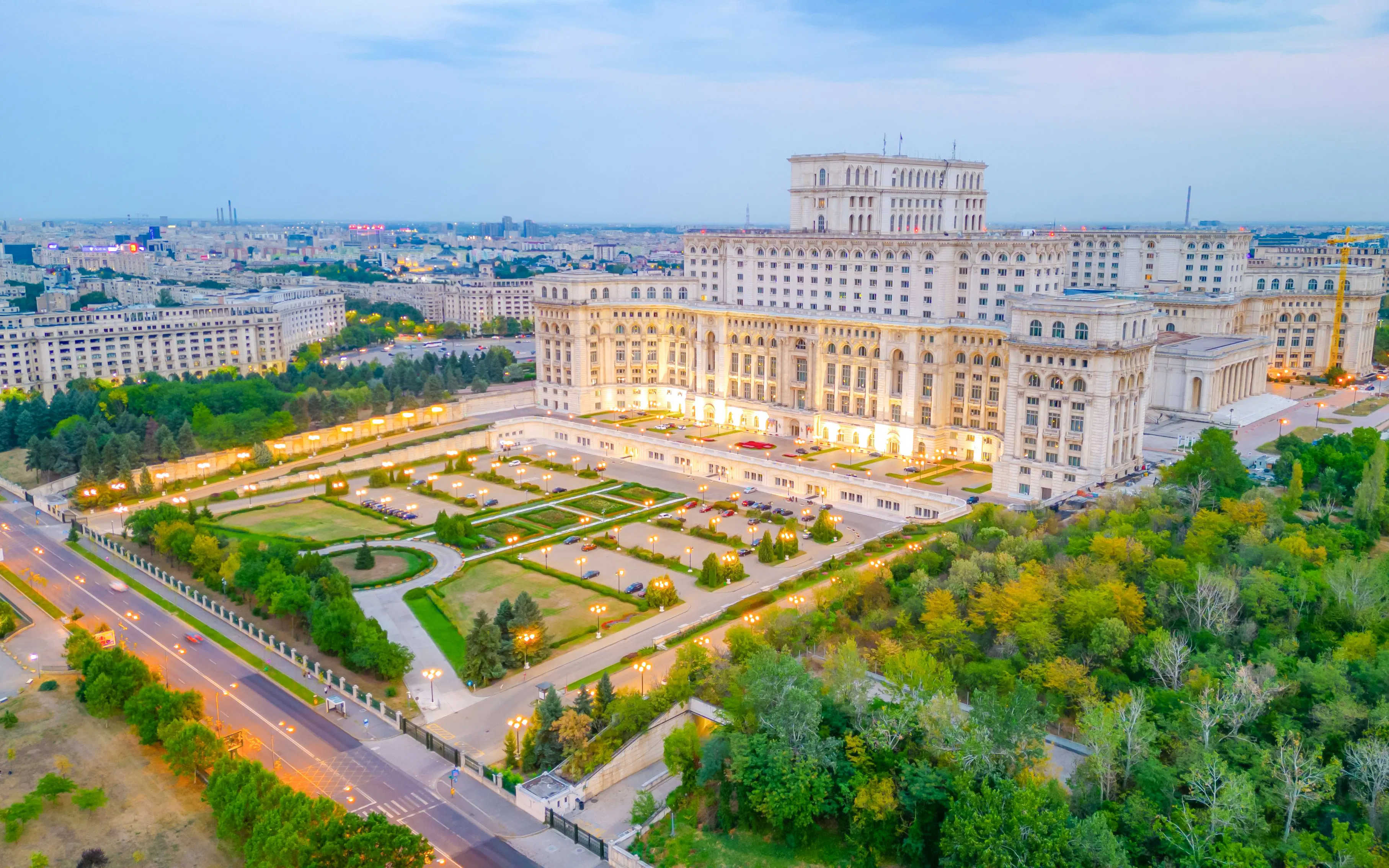 Palace of Parliament illuminated at dusk, Bucharest, Romania.