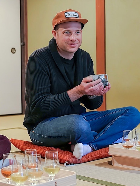 Father and daughter enjoying a private tea ceremony with seasonal wagashi in Japan.