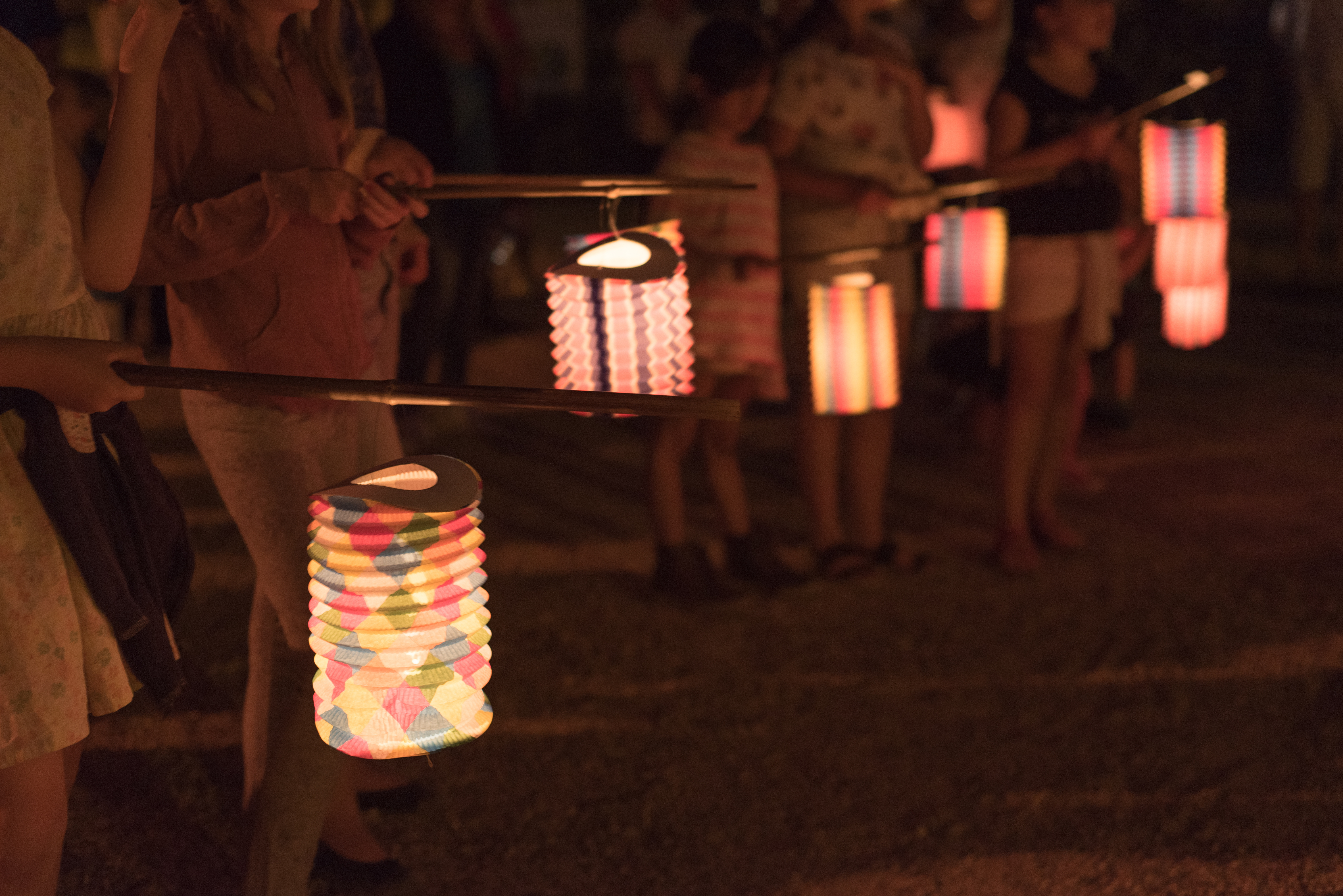 kids holding handmade paper lanterns