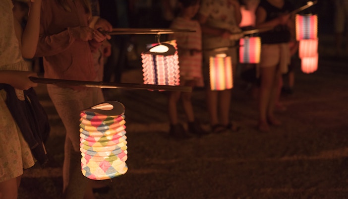 kids holding handmade paper lanterns