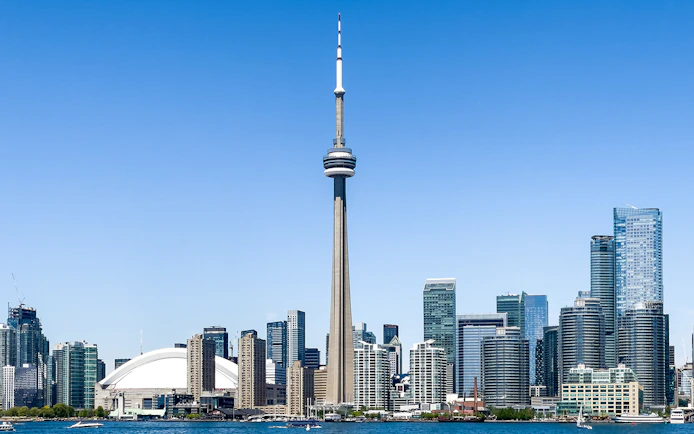 Toronto skyline featuring the CN Tower and surrounding buildings.