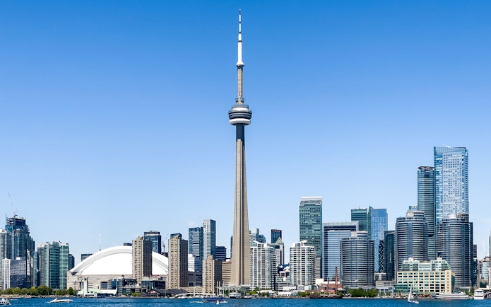 Toronto skyline featuring the CN Tower and surrounding buildings.