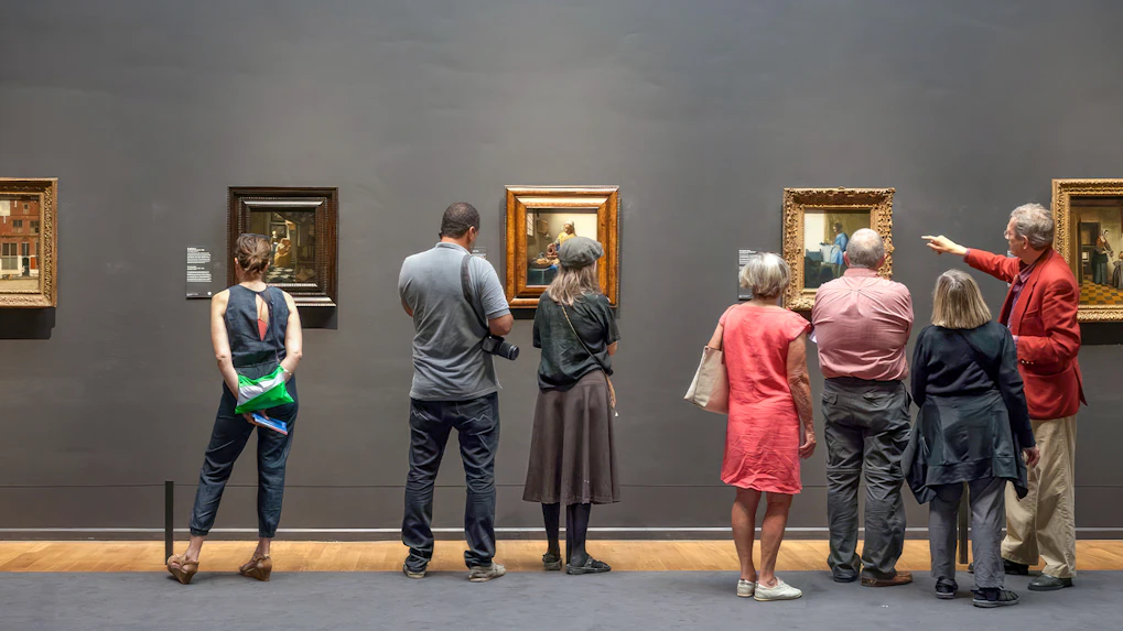 Guests viewing paintings at the Rijksmuseum in Amsterdam.
