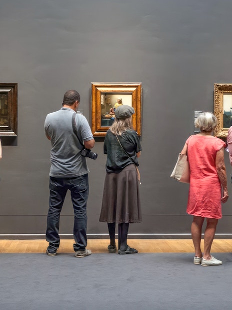 Guests viewing paintings at the Rijksmuseum in Amsterdam.