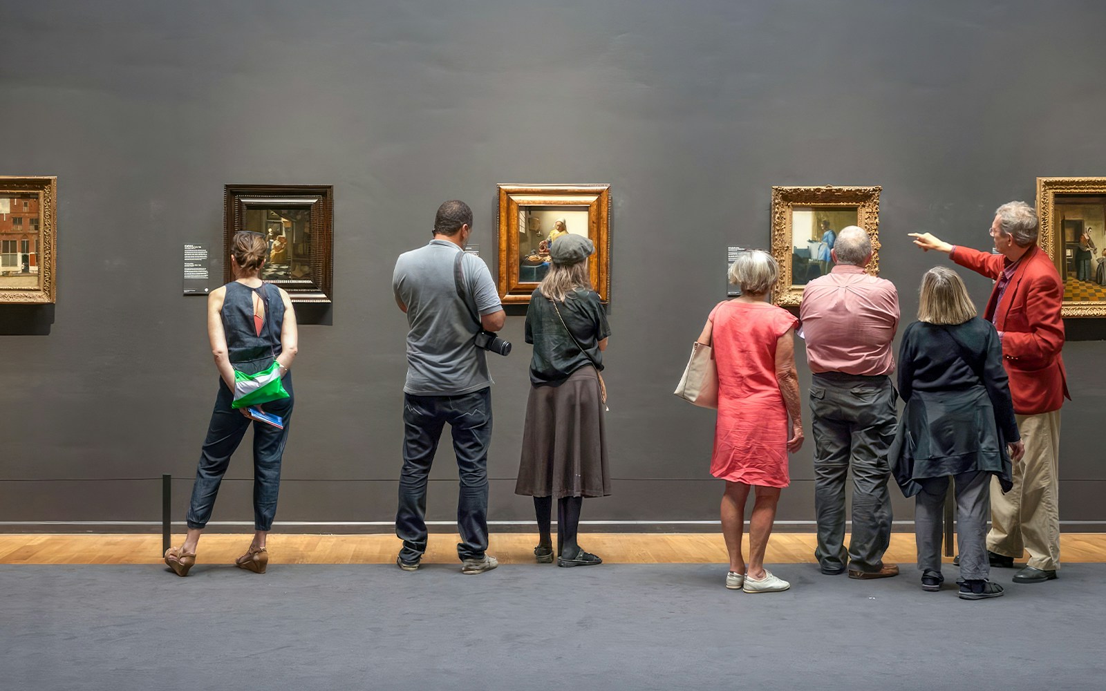 Guests viewing paintings at the Rijksmuseum in Amsterdam.