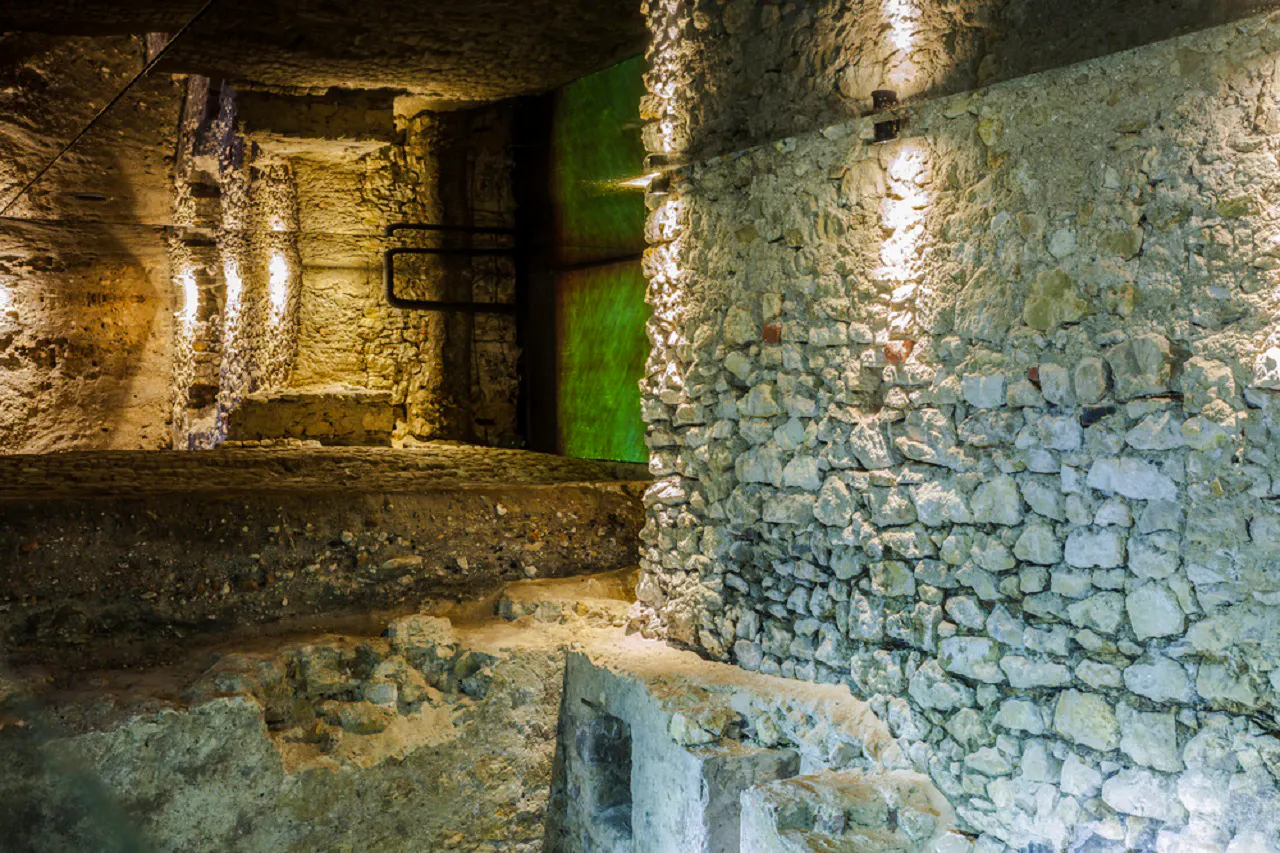 Underground stone walls in Krakow's museum, part of the Old Town tour.