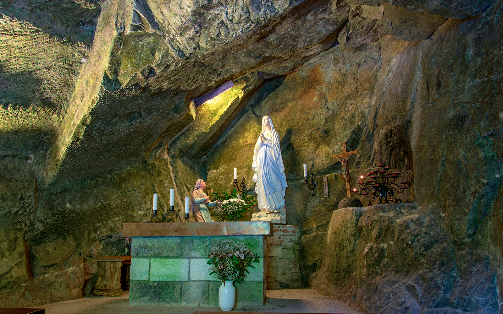 Underground Naples worship place with ancient stone arches and dimly lit passageways.
