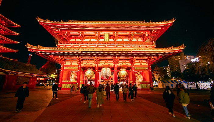 Sensoji Temple in Asakusa, Tokyo with tourists exploring the historic site.