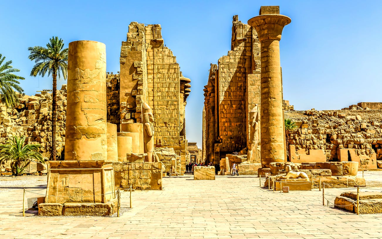 Ancient ruins with columns and statues at Valley of the Queens, Luxor.