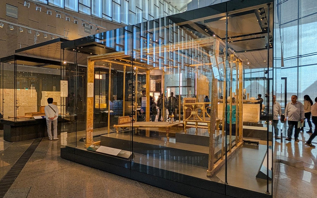 Exhibit of ancient Egyptian artifacts inside the Grand Egyptian Museum, Cairo day trip from Hurghada.