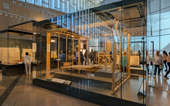 Exhibit of ancient Egyptian artifacts inside the Grand Egyptian Museum, Cairo day trip from Hurghada.