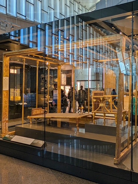 Exhibit of ancient Egyptian artifacts inside the Grand Egyptian Museum, Cairo day trip from Hurghada.