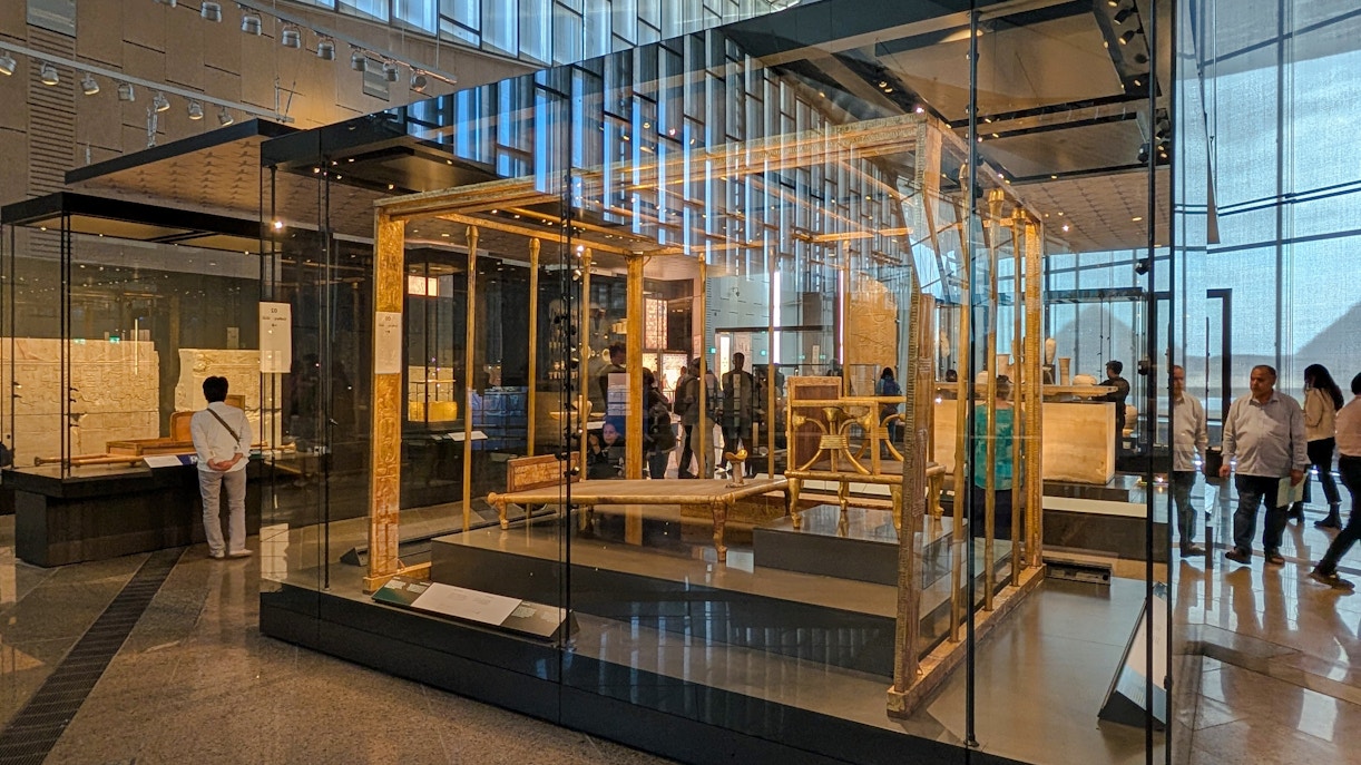 Exhibit of ancient Egyptian artifacts inside the Grand Egyptian Museum, Cairo day trip from Hurghada.