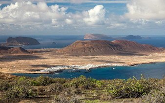 La Graciosa island landscape with volcanic hills and coastal village, Canary Islands.