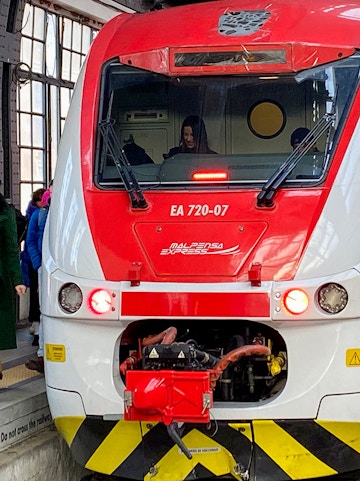 Malpensa Express train at station platform, connecting to Malpensa Airport.